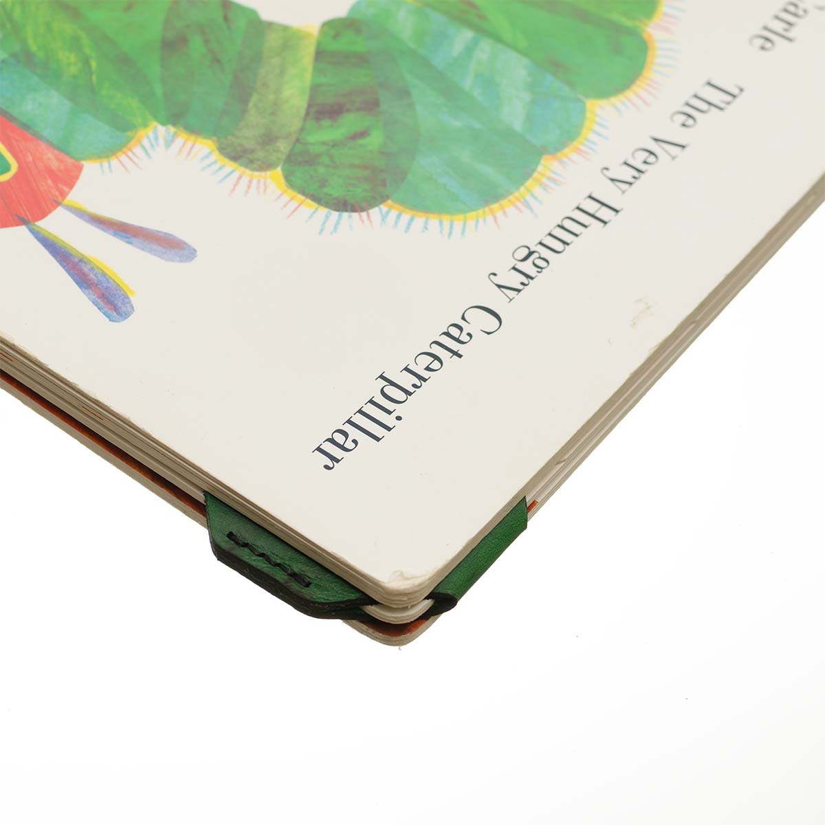 FFF Corner Bookmark — detail showing corner fit on book page