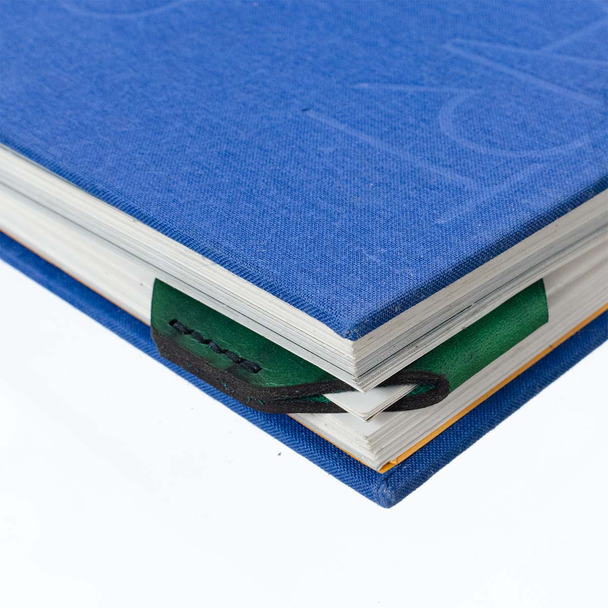 FFF Corner Bookmark — detail showing leather grain and folded triangle shape