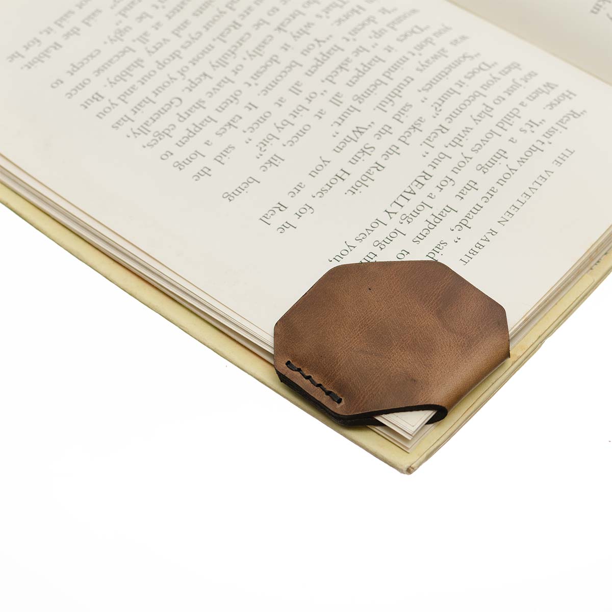 FFF Corner Bookmark — hero shot showing Horween leather corner bookmark in book