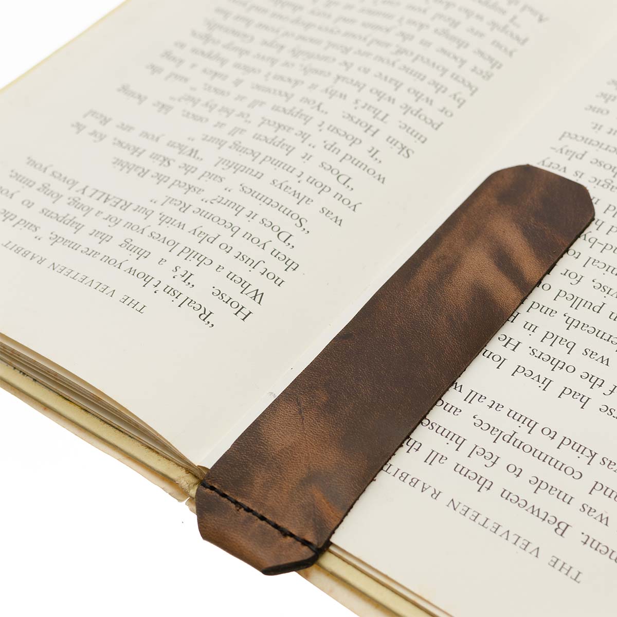 FFF Spine Bookmark — hero shot showing slim Horween leather spine bookmark