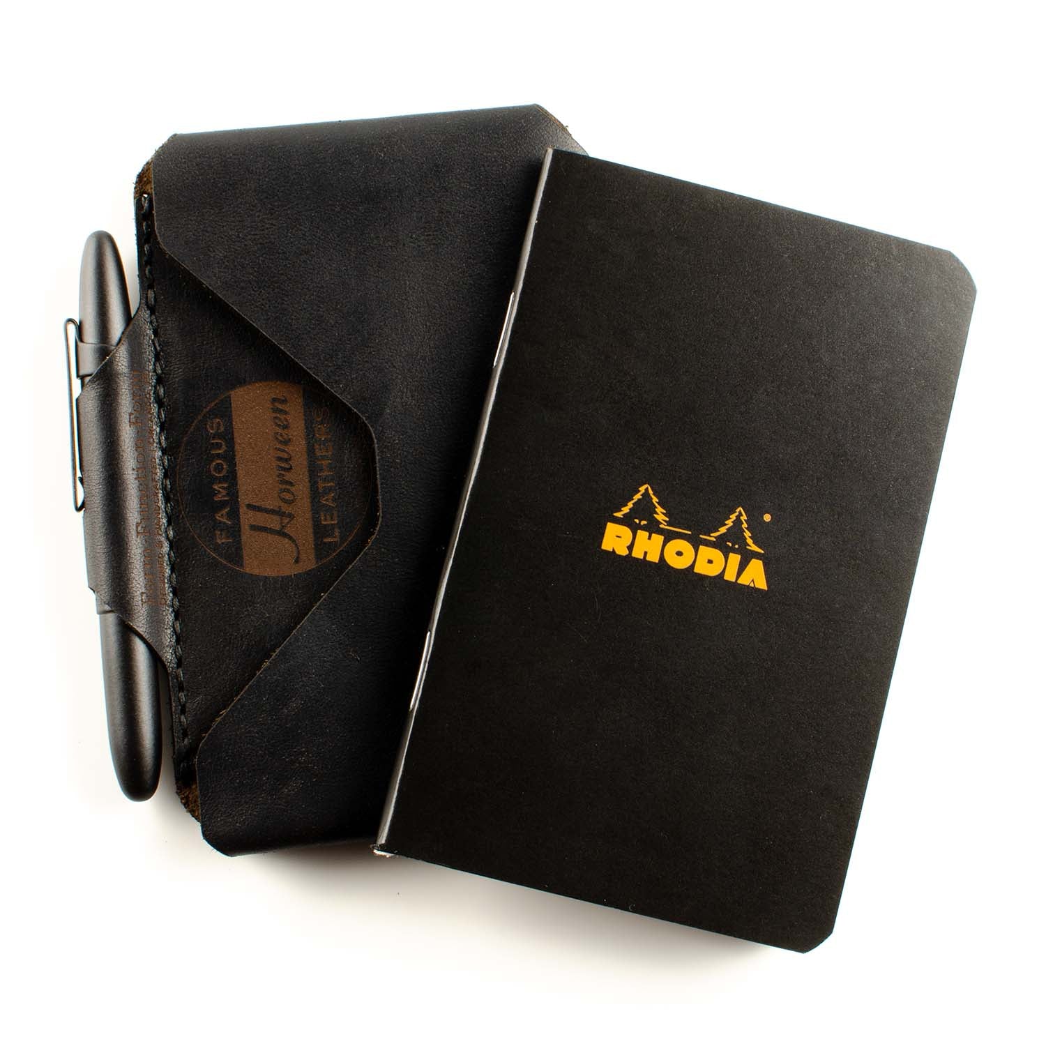 Archslim Wallet — unpacked showing contents: wallet, Rhodia notebook, and pen
