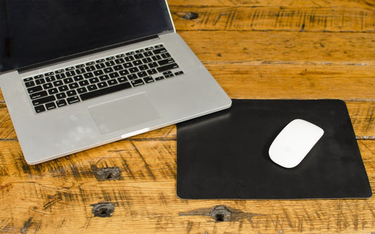 FFF Mouse Pad — detail showing leather surface and stitched border