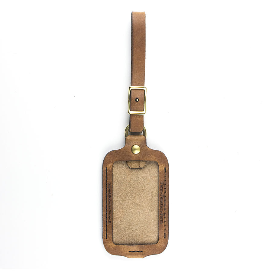 FFF Luggage / ID Tag — detail showing strap attachment and buckle hardware