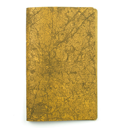 Slip Notebook Cover City Series — lifestyle shot with journal in cover